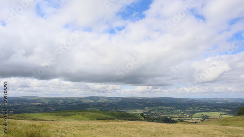 Rolling Hills Under Clouds