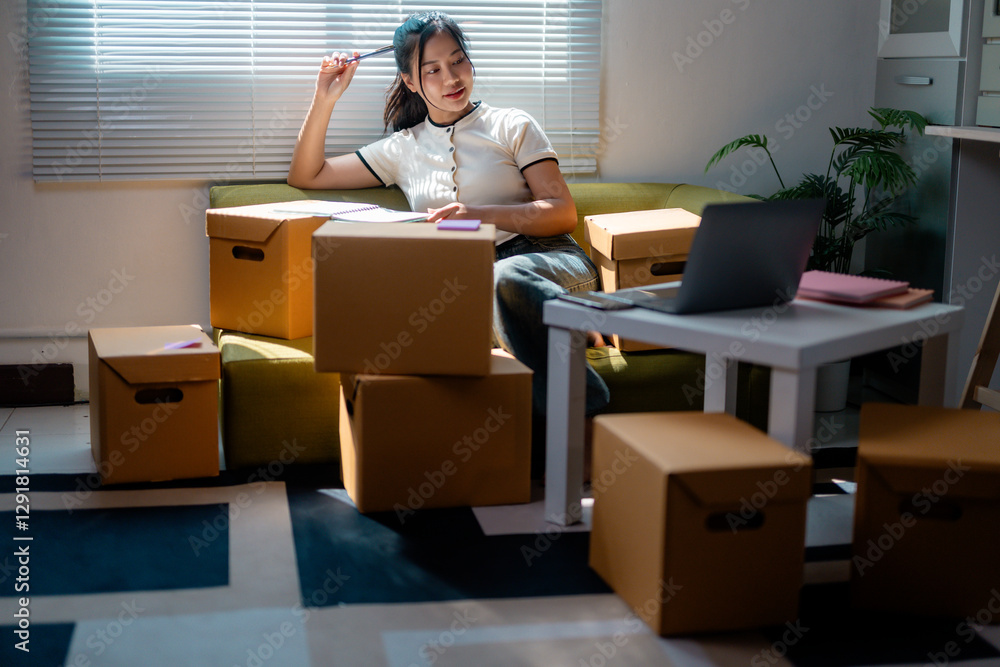 Online seller checking ecommerce orders preparing shipping boxes at home Online seller checking ecommerce orders preparing shipping boxes at home