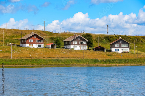 Oceanside wooden houses in Ushuaia, the world's southernmost city in the Tierra del Fuego province of Argentina, South America photo