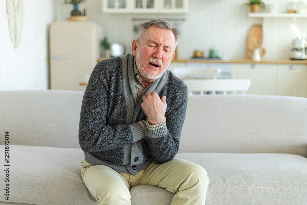 Pain on heart, heart attack. Unhappy middle aged senior man suffering from chest pain heart attack problems with health at home. Mature old senior grandfather touching chest experiencing infarction Pain on heart, heart attack. Unhappy middle aged senior man suffering from chest pain heart attack problems with health at home. Mature old senior grandfather touching chest experiencing infarction