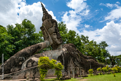 Big reclining Buddha statue at Xieng Khuan Buddha Park in Vientiane Province, Laos, Asia photo