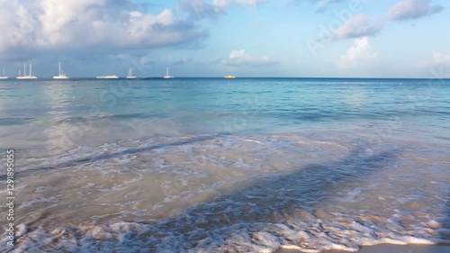 Caribbean beach with white sand and blue sky.