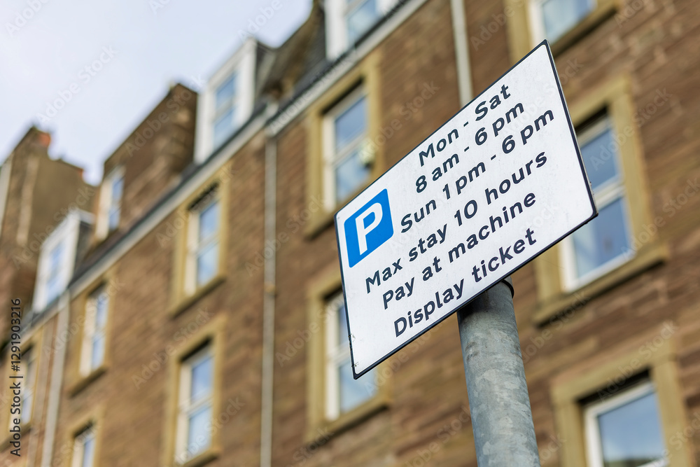 Fototapeta premium Pay and Display Street Car Parking Traffic Information Sign on Metal Post with Time Limit and Instructions