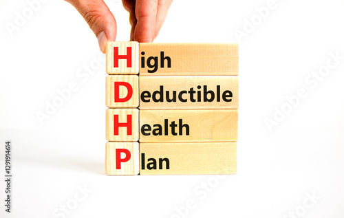 HDHP High Deductible Health Plan symbol. Concept word HDHP High Deductible Health Plan on beautiful blocks. Beautiful white background. Business HDHP High Deductible Health Plan concept. Copy space. photo