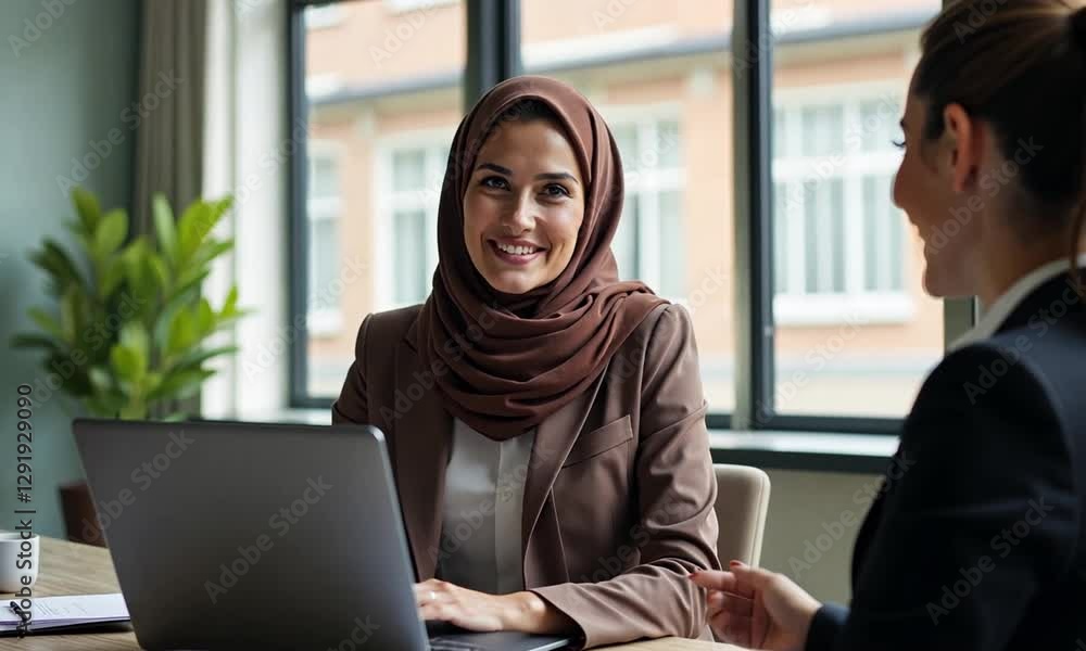 Muslim Businesswoman Meeting with a Client in a Professional Setting Muslim Businesswoman Meeting with a Client in a Professional Setting