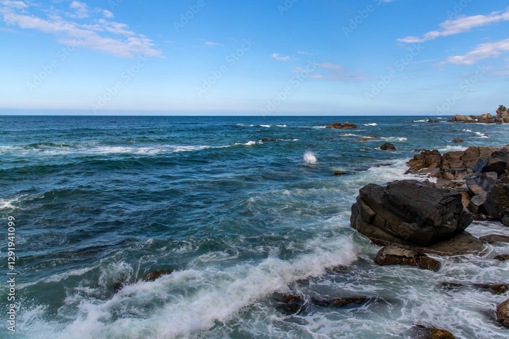 View of the rocky seaside with surf View of the rocky seaside with surf
