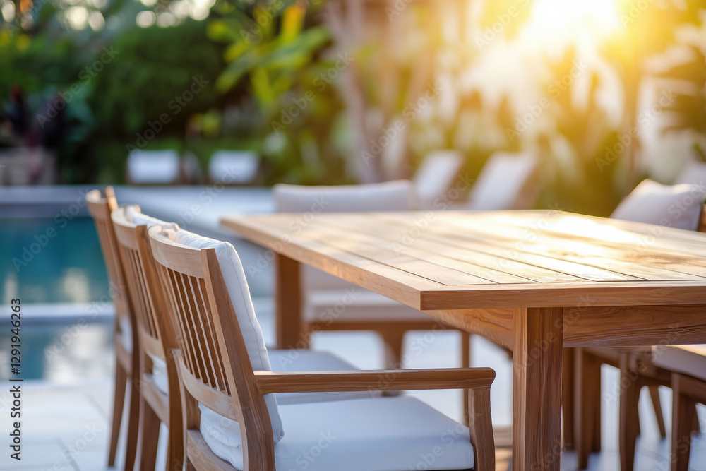 Obraz premium Poolside dining area with modern wooden furniture.