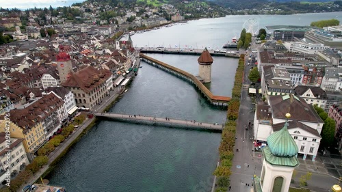 Stunning aerial footage of Kapellbrücke, the iconic Chapel Bridge, showcasing the picturesque beauty of Lucerne, Switzerland.