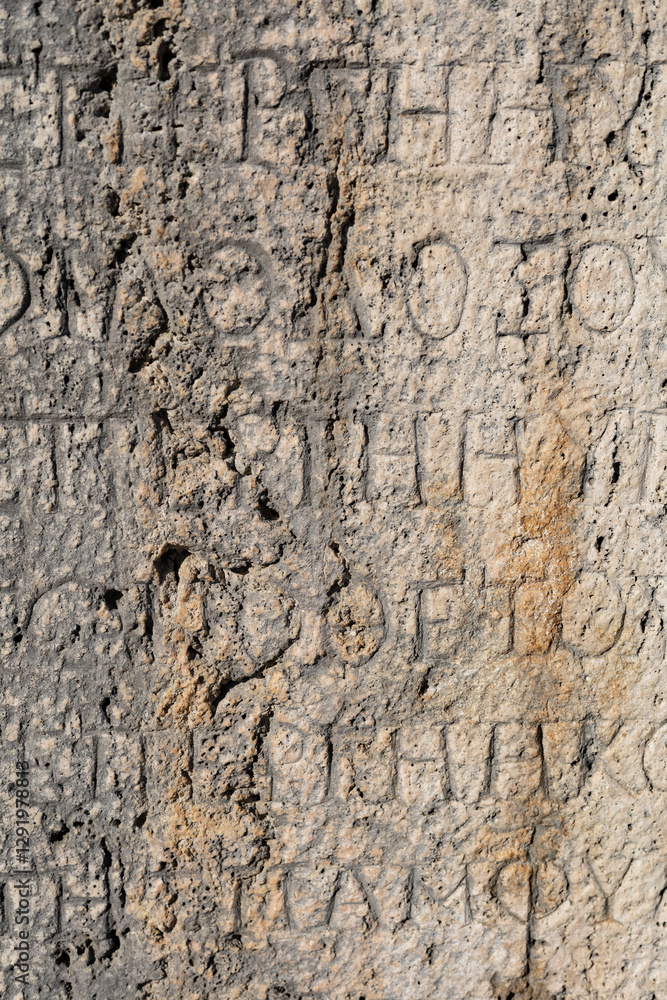 stone wall texture. Antique stone slabs with relief patterns and ornaments. Stone ornaments and carvings on columns and arches of ancient buildings. stone wall texture. Antique stone slabs with relief patterns and ornaments. Stone ornaments and carvings on columns and arches of ancient buildings.