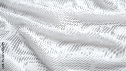 Close-up view of white lacy fabric texture photo