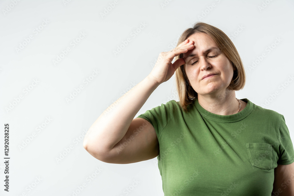 Woman overwhelmed with stress and concern, confusion and doubt, hands to head, on grey background copy space Woman overwhelmed with stress and concern, confusion and doubt, hands to head, on grey background copy space