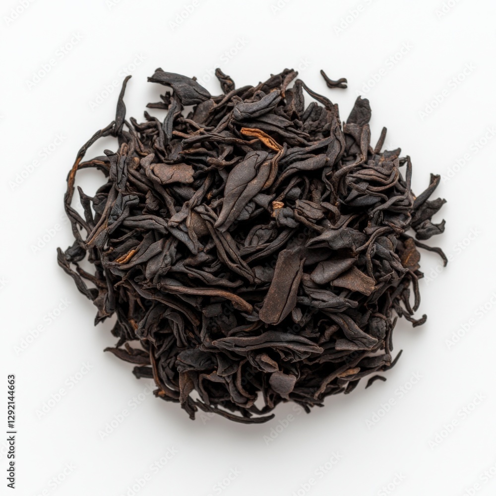 pile of black loose leaf tea on a white background pile of black loose leaf tea on a white background
