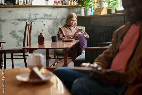 Enjoying Coffee at Cozy Cafe with Natural Ambiance photo