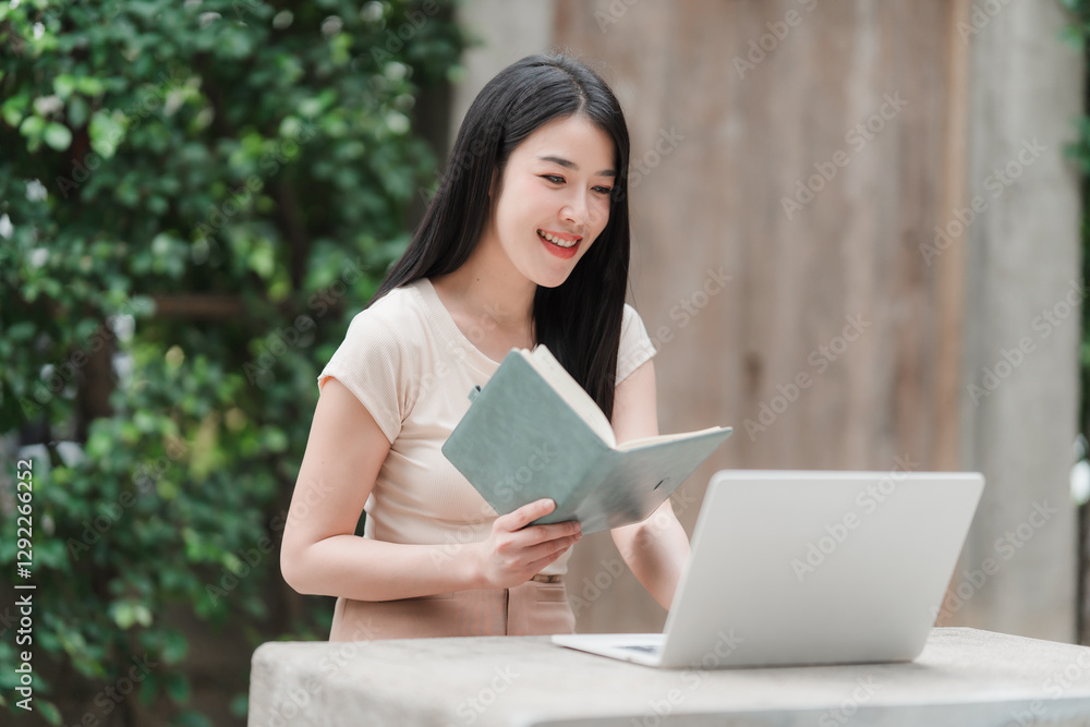 Work-Life Balance: Captivating image of a serene Asian woman, seamlessly blending work with leisure in an outdoor setting, engrossed in both a book and a laptop. Work-Life Balance: Captivating image of a serene Asian woman, seamlessly blending work with leisure in an outdoor setting, engrossed in both a book and a laptop.