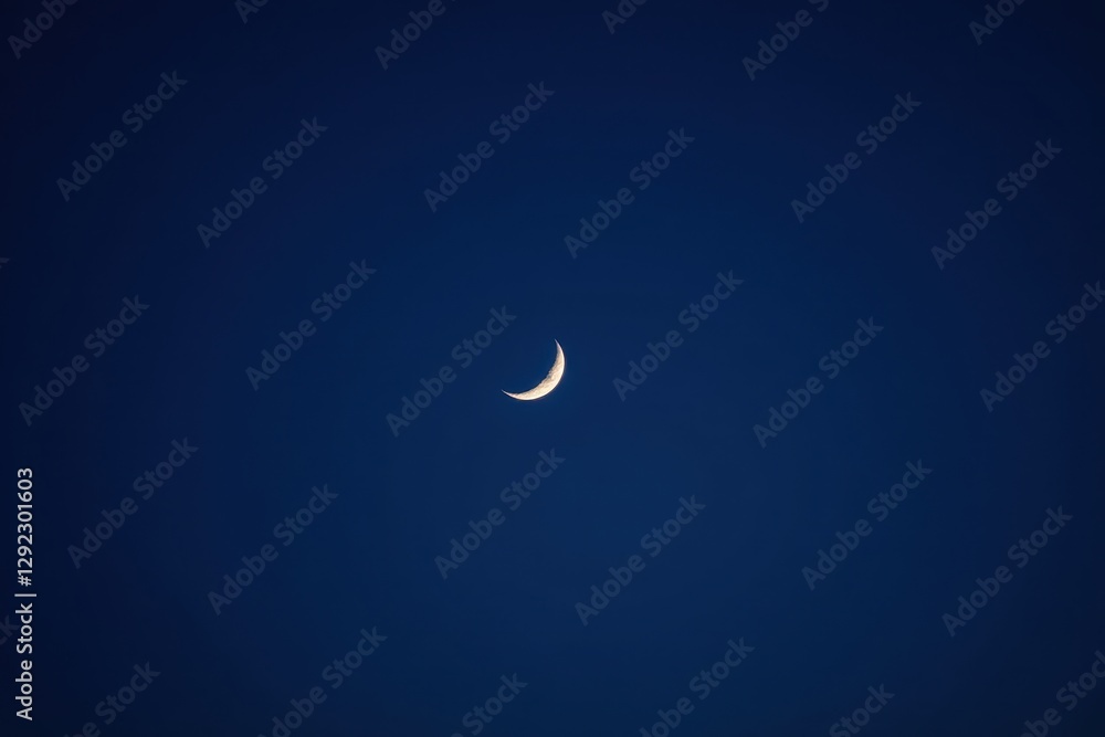 Close-up view of thin crescent moon against deep blue, lunar, stellar Close-up view of thin crescent moon against deep blue, lunar, stellar