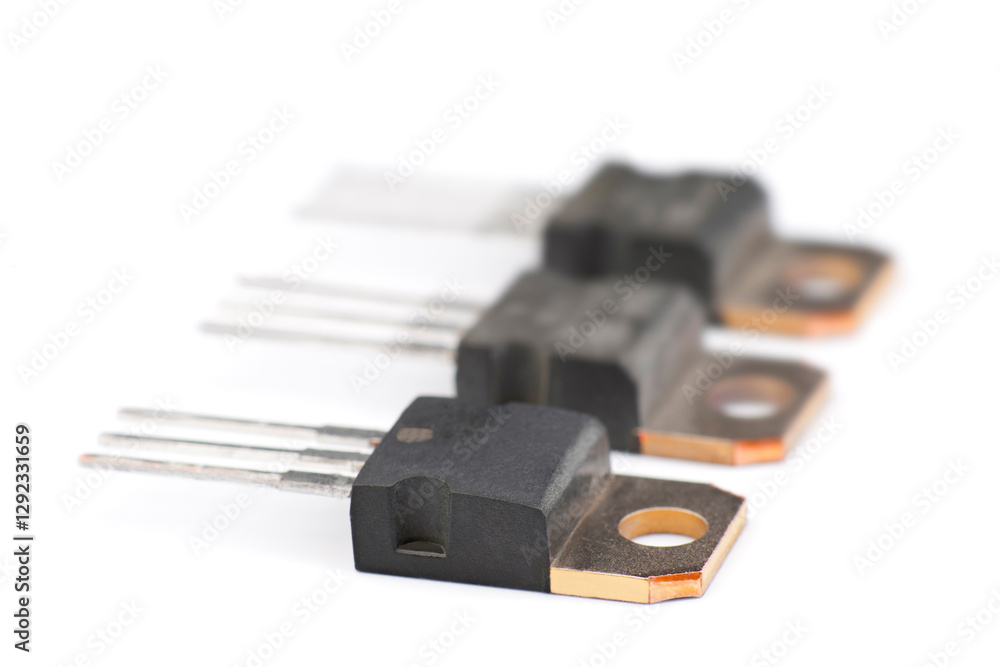 Close-up view of electronic components on a white background showcasing technology details Close-up view of electronic components on a white background showcasing technology details