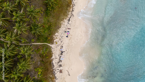 Fototapeta Naklejka Na Ścianę i Meble -  Aerial view of white waves coming to Cayo Zapatilla shore. Bocas del Toro archipelago, Panama, Caribbean, Central America.