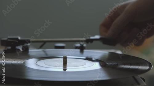 Close Up of Hands Taking a Vinyl Record off of a Record Player