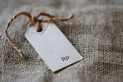 Close-up of RRP Tag Displaying Recommended Pricing Against a Blurred Background photo