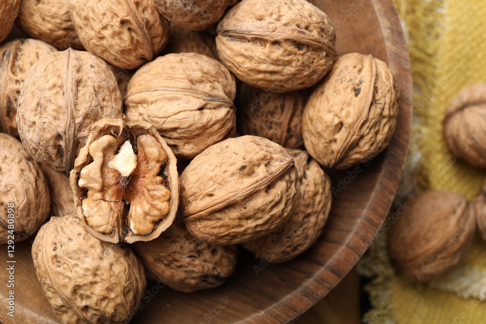 Fresh ripe walnuts in shells on table, top view Fresh ripe walnuts in shells on table, top view