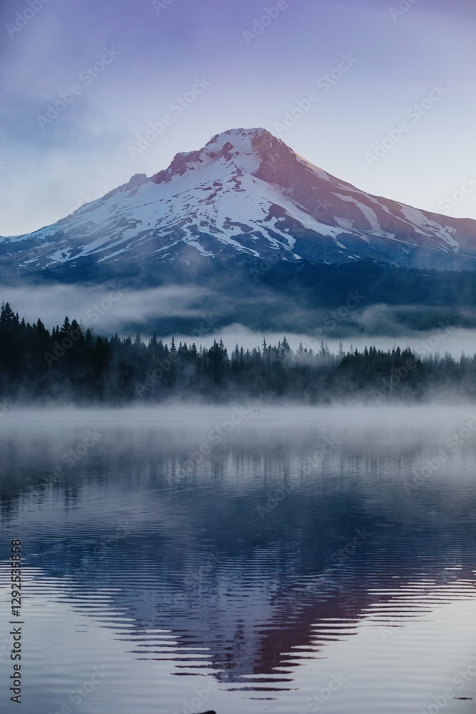 Misty morning on Trillium Lake, Mt. Hood reflected in the calm water. Fishermen enjoy the tranquil scene. Oregon, United States Misty morning on Trillium Lake, Mt. Hood reflected in the calm water. Fishermen enjoy the tranquil scene. Oregon, United States