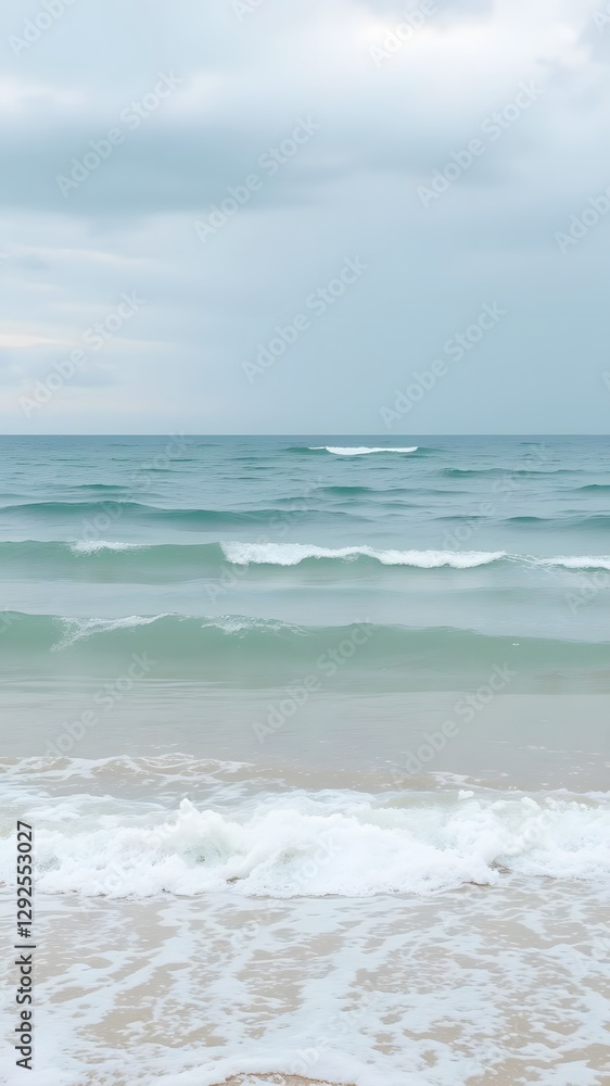 Ocean Waves in Light Cream and Aqua with Soft Shoreline Under Cloudy Sky Ocean Waves in Light Cream and Aqua with Soft Shoreline Under Cloudy Sky