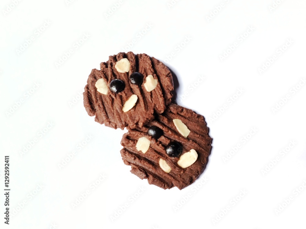 Delicious chocolate cookies with chocochip topping and almond slices isolated on white background. Delicious chocolate cookies with chocochip topping and almond slices isolated on white background.