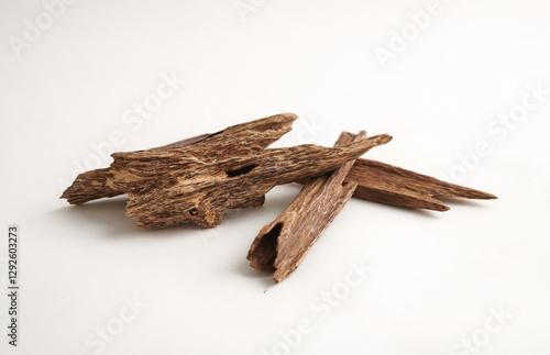 Close-Up of Agarwood (Oud) Sticks isolated on white background – Precious Aromatic Wood