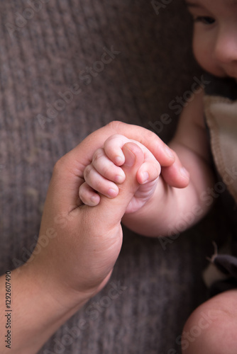 Little newborn baby hands and fingers delicate close up