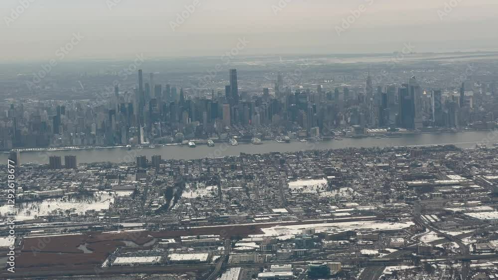 New York City winter skyline with Hudson River view from plane window New York City winter skyline with Hudson River view from plane window