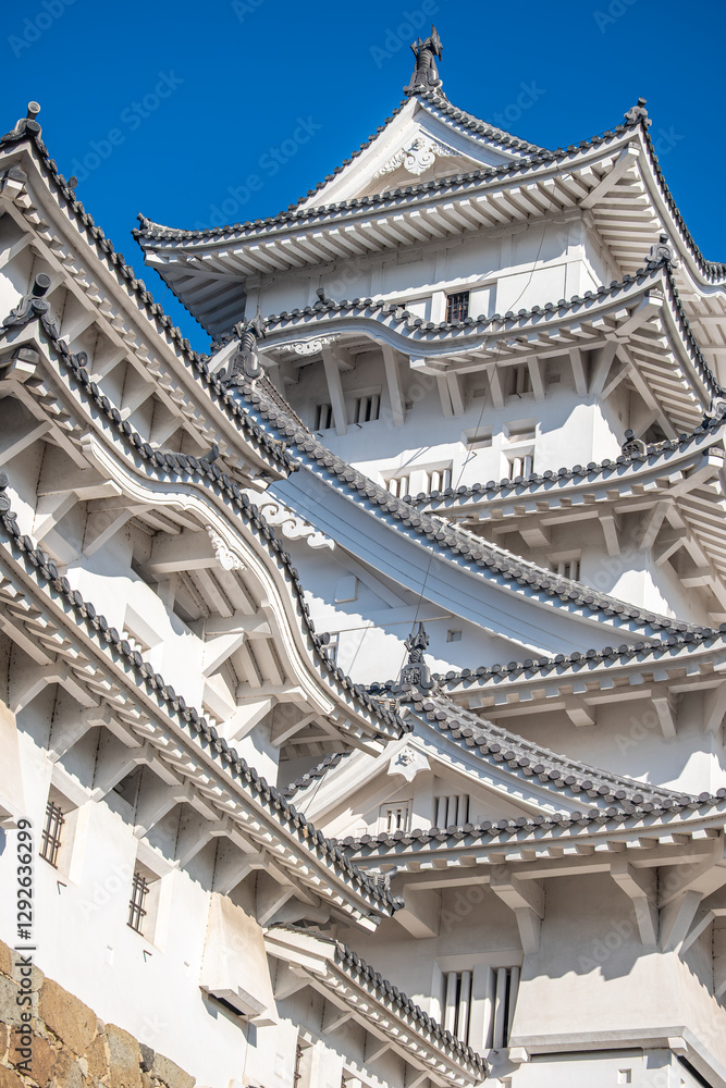 Himeji castle, Elegant Asian architecture against blue sky at Himeji, Japan Himeji castle, Elegant Asian architecture against blue sky at Himeji, Japan