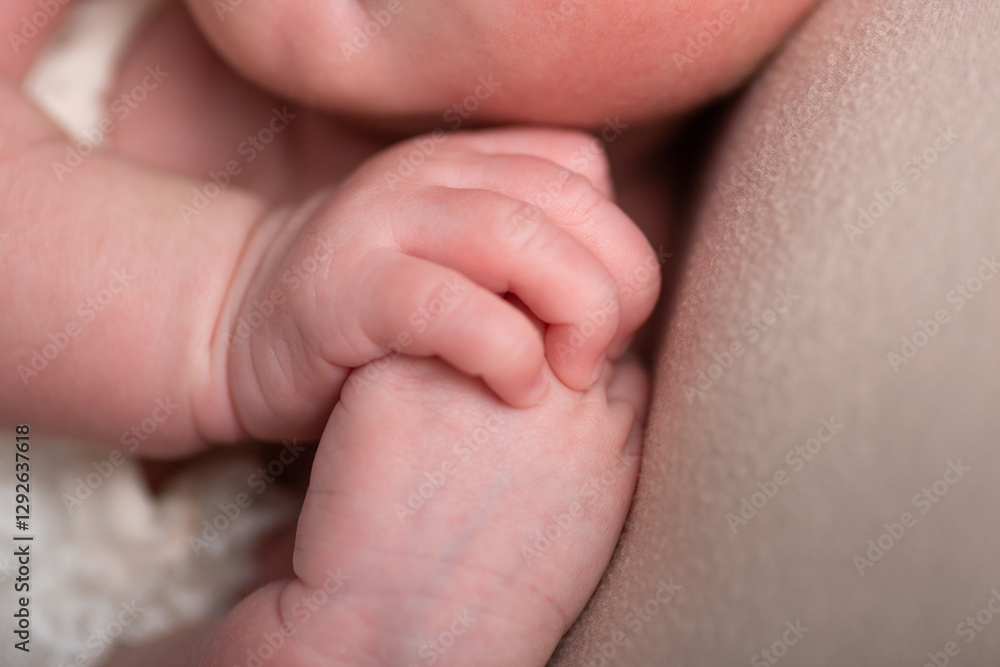 Tiny newborn baby human hands and fingers Tiny newborn baby human hands and fingers