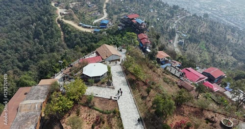 Aerial Pokhara's Peace Pagoda view: Path downhill, hillside buildings