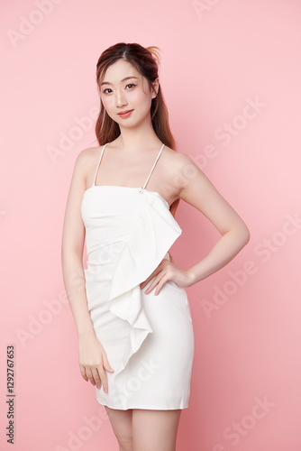 Beautiful face of young Asian woman in sexy dress white Perfect slim body on pink background, plastic surgery and aesthetic cosmetology, Facial and skin care concept photo