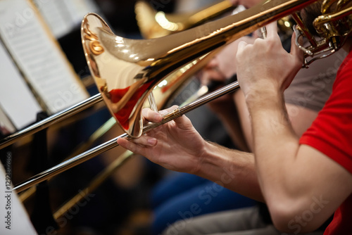  Close-up of musician's hands playing trombone
