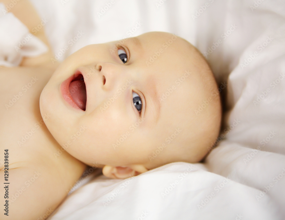 Portrait, happy and baby in nursery, relax and comfortable on bed, healthy and peaceful in house. Morning, awake and infant in bedroom, smile and adorable in home, resting or child with cozy blanket Portrait, happy and baby in nursery, relax and comfortable on bed, healthy and peaceful in house. Morning, awake and infant in bedroom, smile and adorable in home, resting or child with cozy blanket