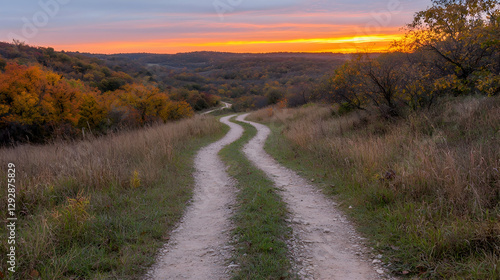 Winding dirt road sunset autumn landscape