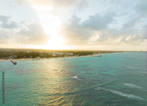 A beautiful ocean view with a sunset in the background