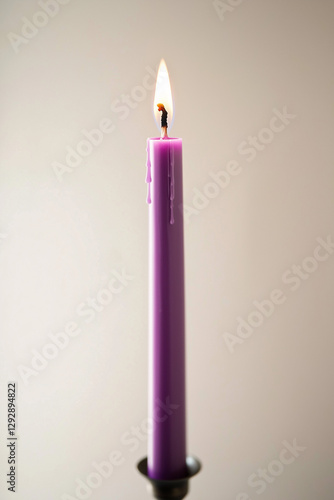 A vibrant violet candle fla...
