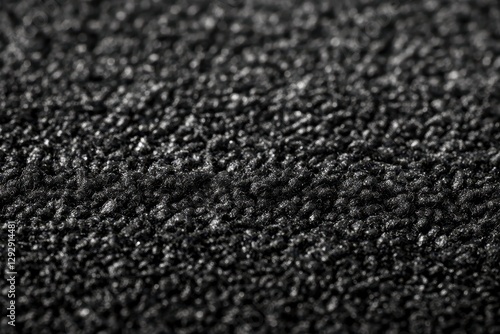 smooth texture and expansive close up of black synthetic car mat photo