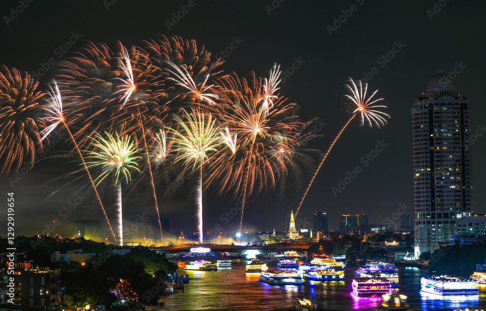 View of Bangkok, Thailand at night, with the Chao Phraya River, beautiful fireworks and boats. Photo taken on 22 Dec 2023.