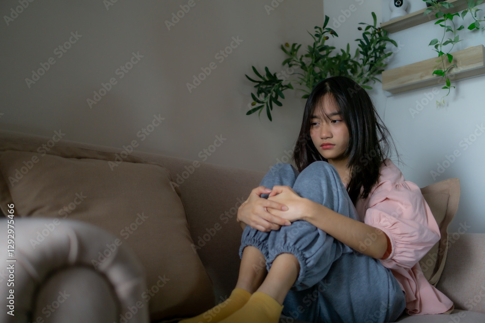 Fototapeta premium Asian depression teenager covering her face feeling anxious and unhappy.
