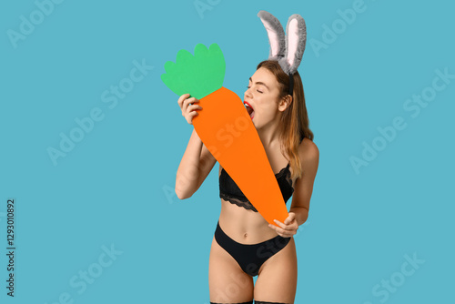 Sexy young woman in bunny e...
