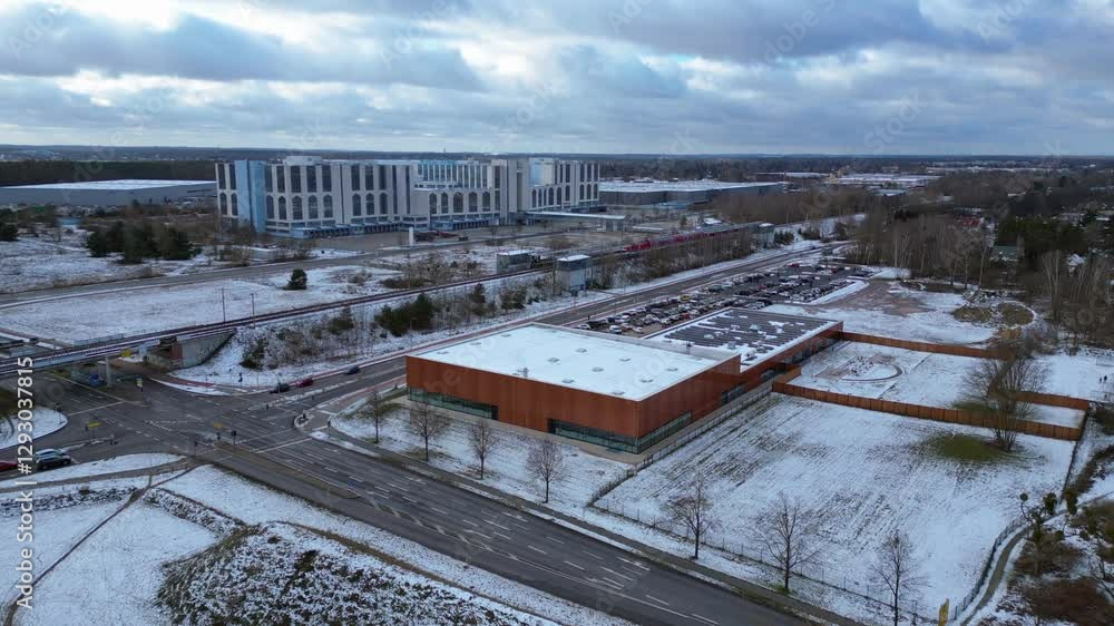 train traveling through a snowy cityscape in segefeld Falkensee. Great aerial view flight static tripod hovering drone train traveling through a snowy cityscape in segefeld Falkensee. Great aerial view flight static tripod hovering drone