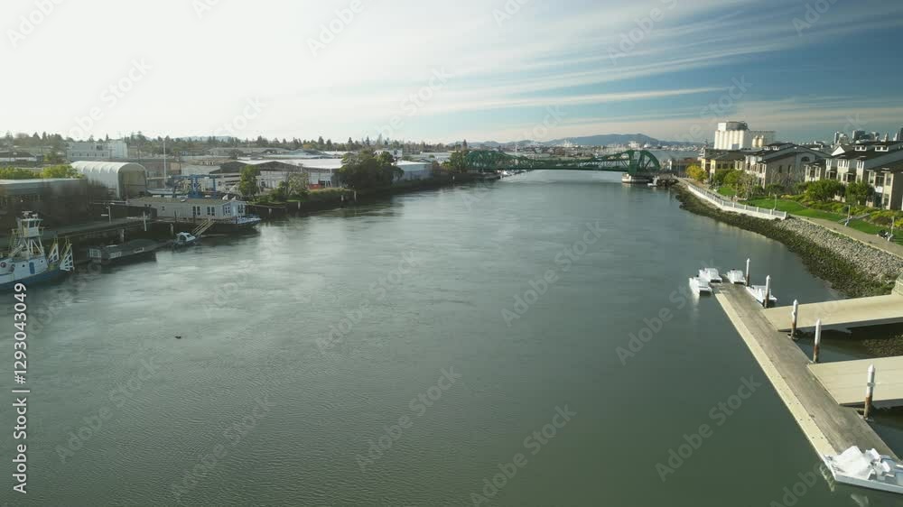 A drone glides above the Tidal Canal, highlighting the green steel structure of the Park Street Bridge. A drone glides above the Tidal Canal, highlighting the green steel structure of the Park Street Bridge.