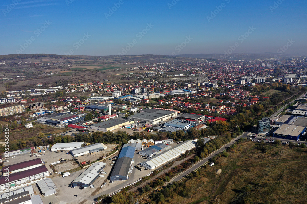Fototapeta premium Factories in suburban industrial area aerial view