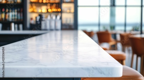 Minimalist and elegant seaside caf featuring a sleek marble bar top and panoramic ocean views through the glass walls creating a sophisticated and tranquil ambiance for dining relaxation and business