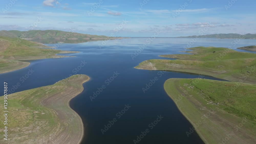 Low moving view over blue water lake San Luis Reservoir Low moving view over blue water lake San Luis Reservoir