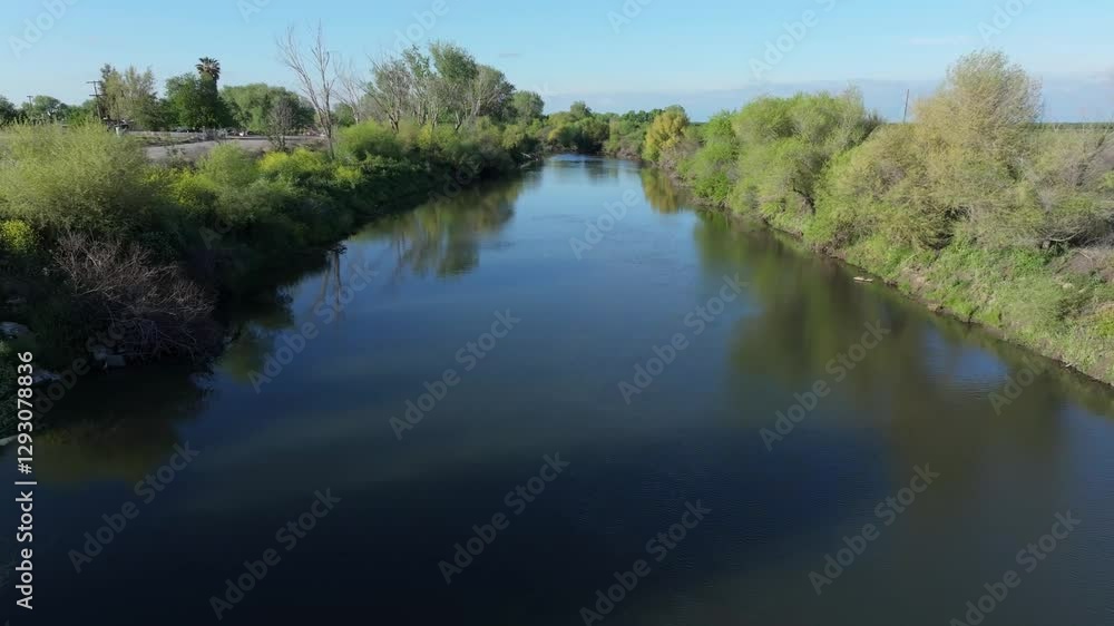 Moving low over San Joaquin River irrigation canal Moving low over San Joaquin River irrigation canal