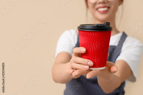 Smiling barista offering re...